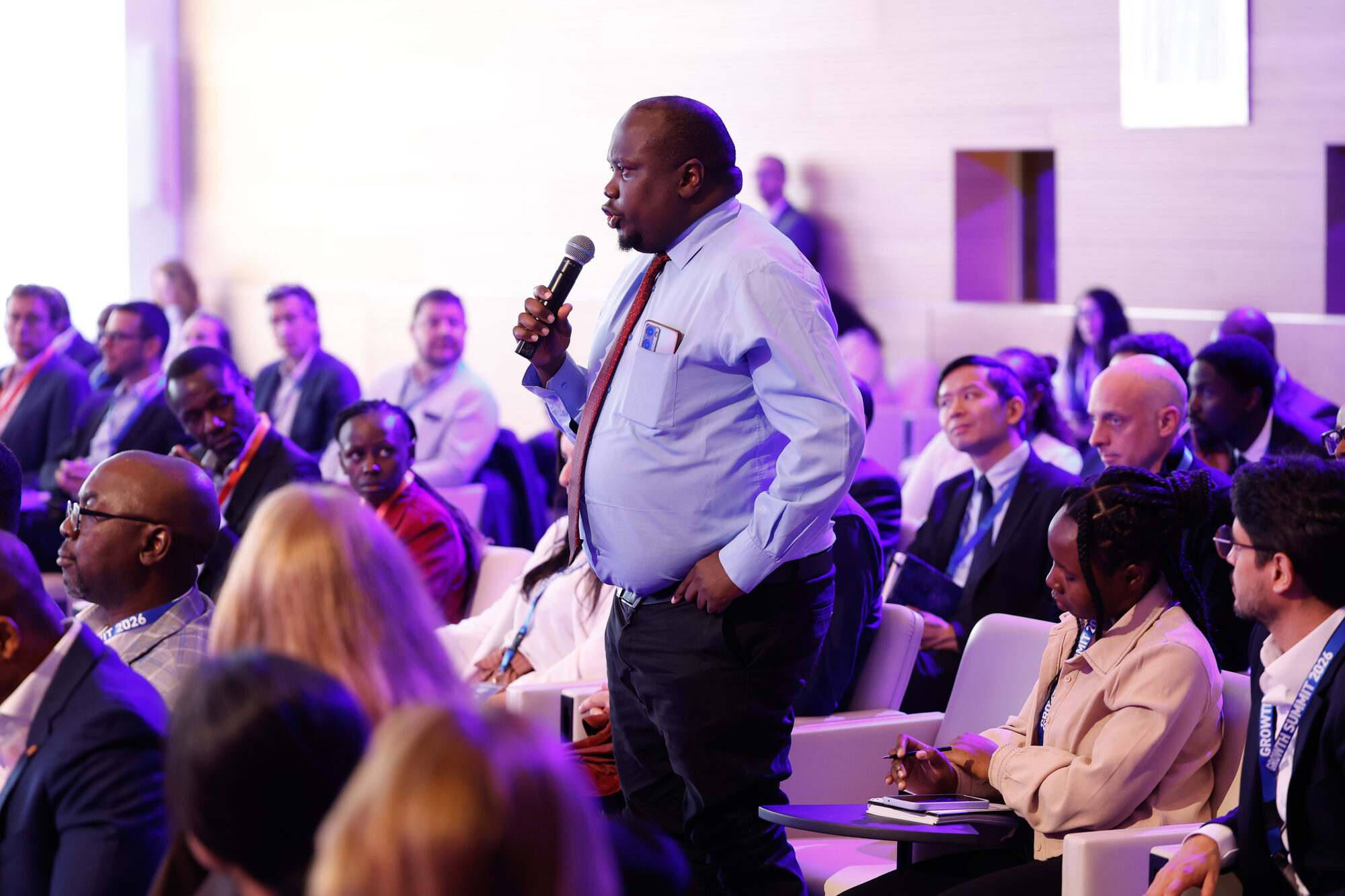 A delegate asking a question from the floor