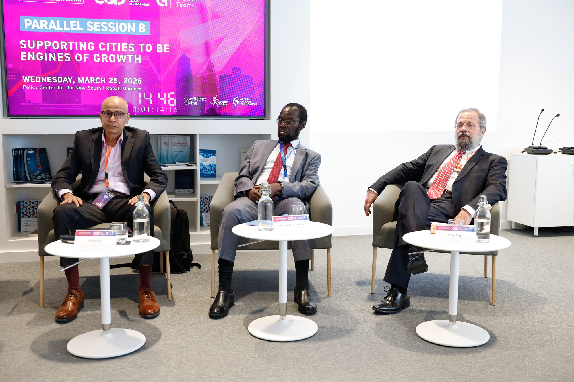 Panellists seated on stage